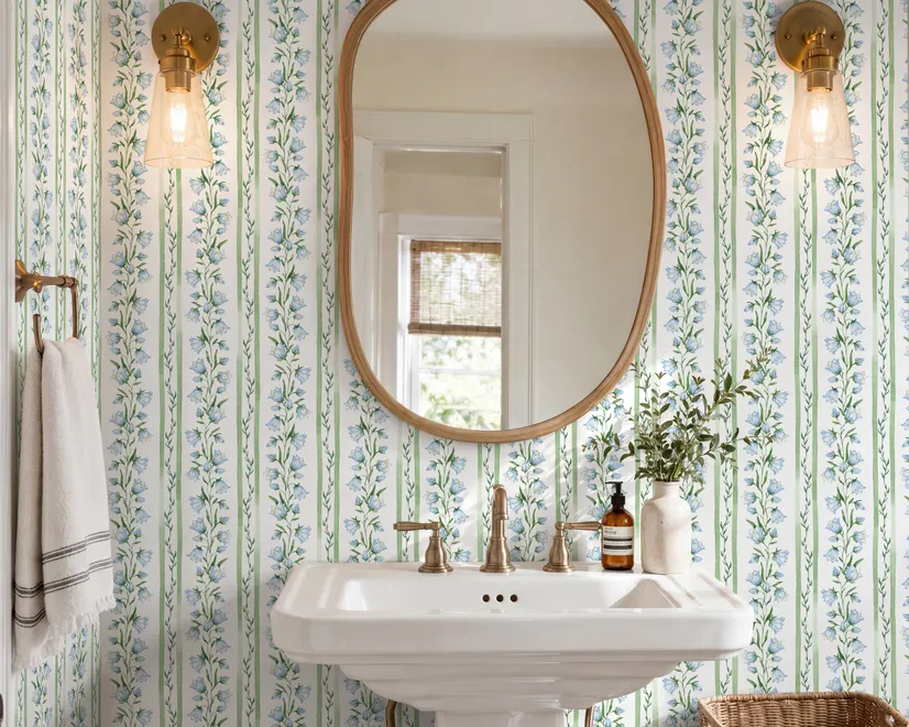 Blue floral stripe wallpaper with pale sky-blue bell flowers, green vines and sage bands on white