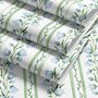 Blue floral stripe wallpaper with pale sky-blue bell flowers, green vines and sage bands on white