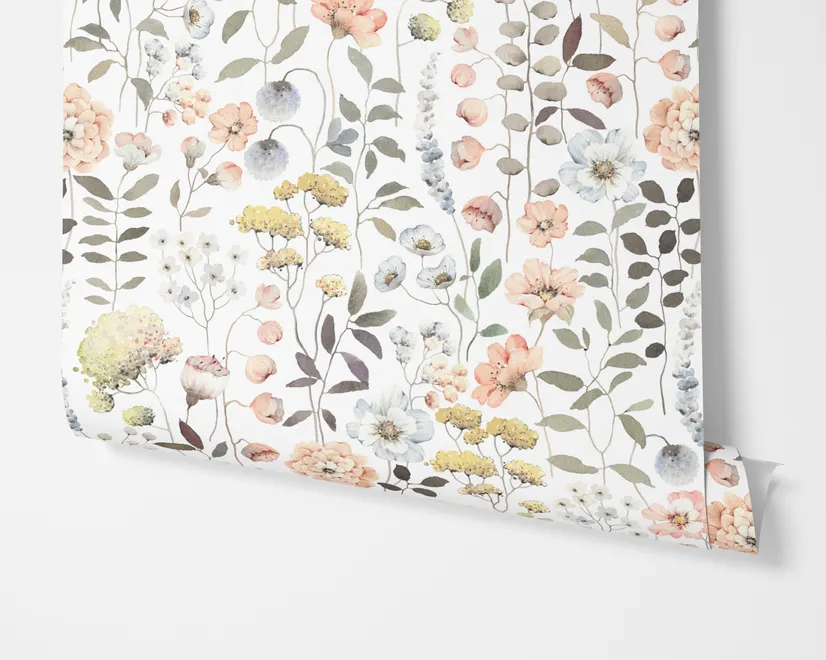 Watercolour wildflower wallpaper with pastel flowers and sage leaves on a white ground