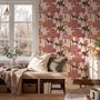 Tropical foliage wallpaper with black panthers, pink palace facades and ochre palms on pale peach