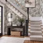 Monochrome wallpaper with grey tree toile on a clean white ground