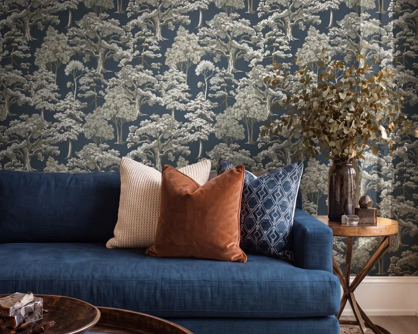 Navy wallpaper with warm ivory and taupe grey toile tree repeat on deep slate blue ground