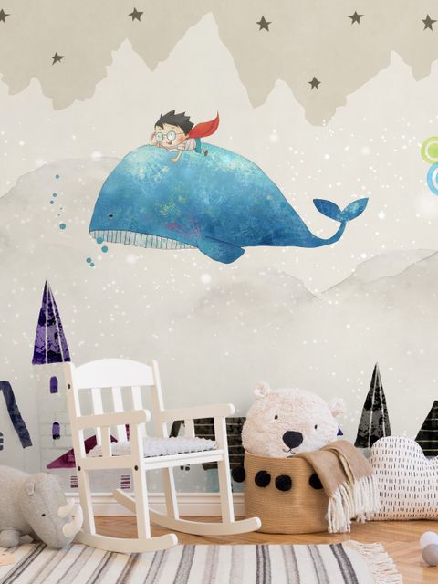 Papier peint panoramique village et petit enfant sur la baleine volante