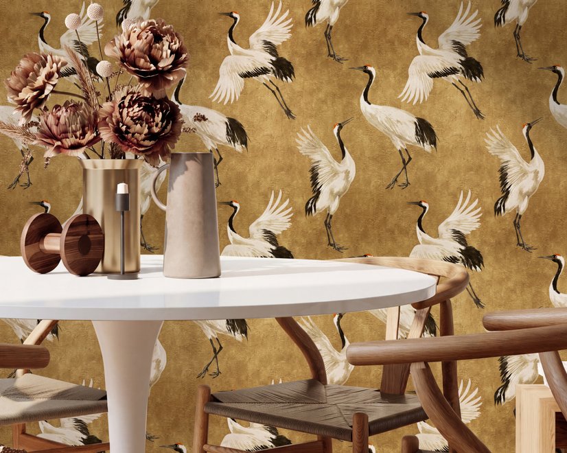Japanese crane wallpaper with white, black and red cranes in flight on an antique-gold textured ground