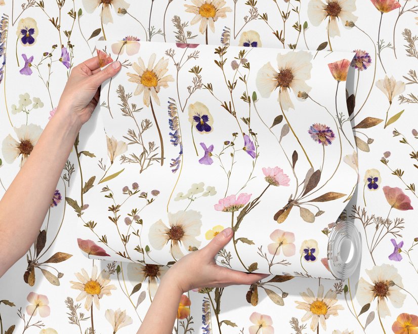 Cute spring wallpaper with pressed ivory, pink, blue and yellow wildflowers on a white ground