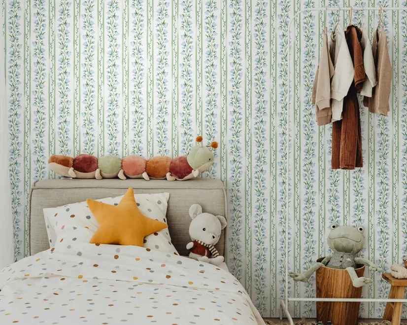 Blue floral stripe wallpaper with pale sky-blue bell flowers, green vines and sage bands on white