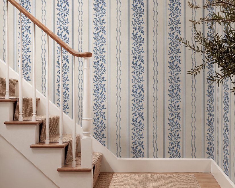Blue wallpaper with indigo botanical stripework, pinstripes and dotted borders on warm cream parchment