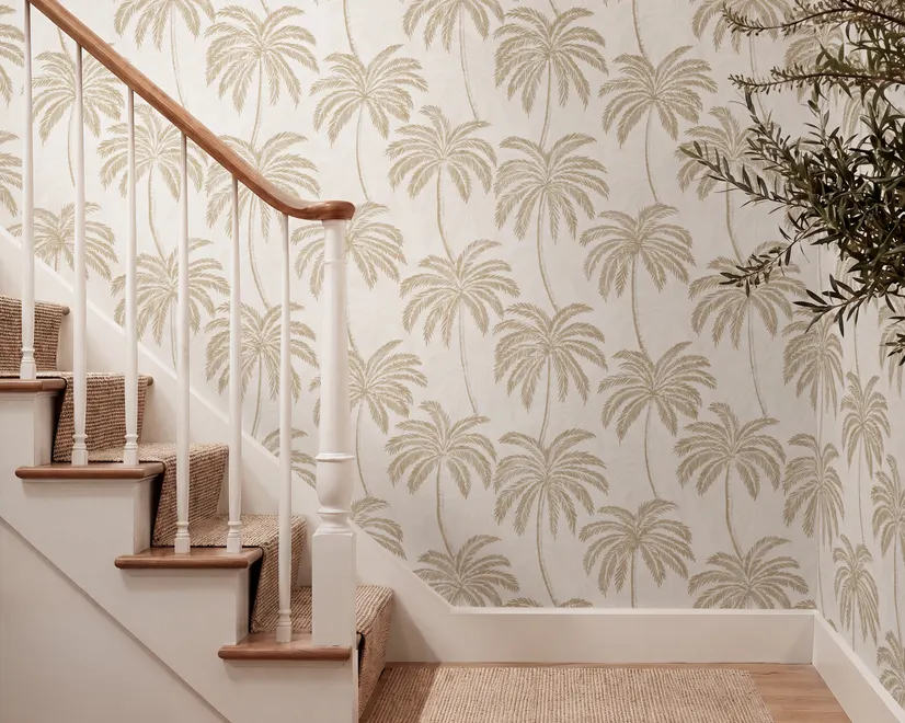 Muted sandy taupe palm trees and pale foliage on a creamy ivory ground tropical wallpaper